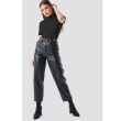 Women's black half sleeve solid top paired with casual pants