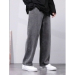 Angled side view of grey loose fit denim jeans for men