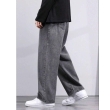 Side profile of men's grey loose fit jeans