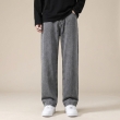 Full-length grey loose fit jeans styled for casual wear