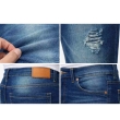 Close-up detail of blue skinny jeans fabric and stitching