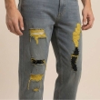 Distressed knee design detail on grey regular fit jeans
