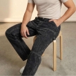 Close-up view of black straight fit jeans fabric and fit