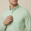 Close-up of light green printed casual shirt for men