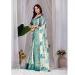 Elegant look of women's off-white and teal printed lichi silk saree