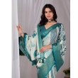 Fashion model showcasing teal printed lichi silk saree