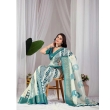 Draped style of off-white and teal printed lichi silk saree