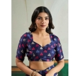 Woman in navy blue saree
