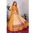 Beautiful yellow lehenga outfit with matching dupatta and unstitched blouse fabric