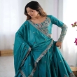 Close-up of embroidered teal green lehenga choli with detailed sequence work