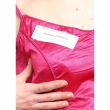 Close-up fabric detail of pink polysilk V-neck blouse