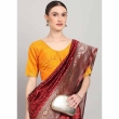 Orange U-neck blouse paired with traditional saree
