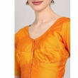 Close-up detail of orange U-neck blouse for women