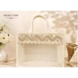 woman carrying beige white jute handbag daily use