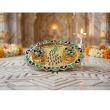 ornamental gold kankavati plate with peacock design for home decor