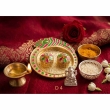 small kumkum plate with decorative peacock motif in multicolor