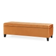 close up orange tufted ottoman button stitched upholstery