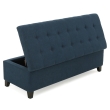 close up blue tufted ottoman button stitched upholstery