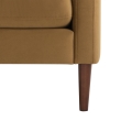 Soren orange upholstered lounge chair with tufted back and solid wood legs