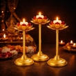 Lotus-shaped candle holders with antique finish