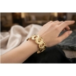 SOLMARE VENTURES gold-plated stainless steel cuff bracelet worn on wrist