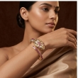 Elegant gold bracelet watch with hidden dial and crystal detailing