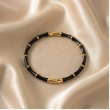 Modern bamboo-inspired bracelet with luxurious midnight onyx finish