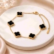 Gold plated black clover bracelet featuring a durable anti-tarnish finish