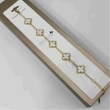 Fashion white clover bracelet with elegant gold-tone detailing